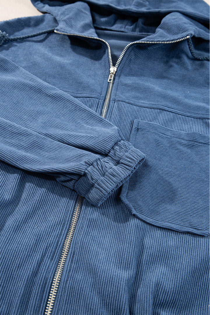 Veste en velours côtelé bleu-vert avec cordon de serrage, capuche et fermeture éclair