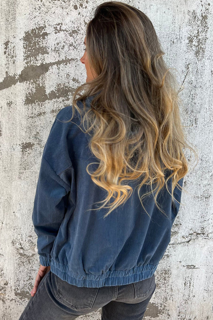 Veste en velours côtelé bleu-vert avec cordon de serrage, capuche et fermeture éclair