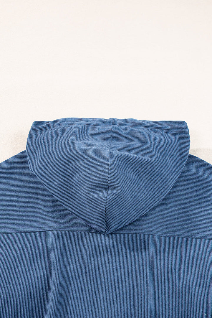 Veste en velours côtelé bleu-vert avec cordon de serrage, capuche et fermeture éclair