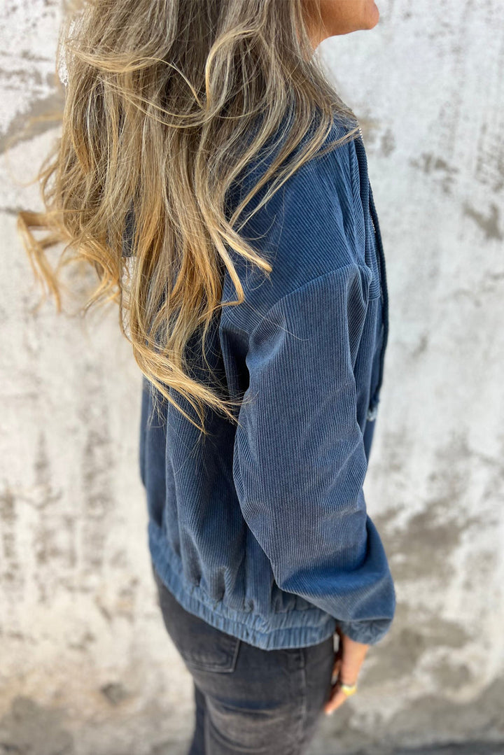 Veste en velours côtelé bleu-vert avec cordon de serrage, capuche et fermeture éclair