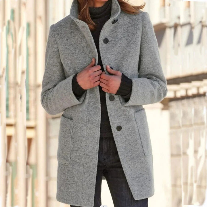 Manteau gris avec col montant et poches
